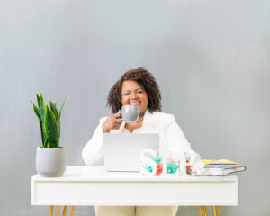 Adaptive Job Skills for Disabled Sitting at desk holding coffee cup